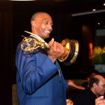Ray Williams accepts his Emmy and smiles