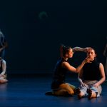 Dancers explore faces on the floor in Language of Landscape