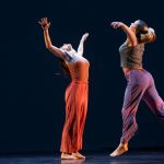 Two dancers on stage in Theta Waves