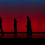 Silhouettes of dancers in Theta Waves