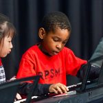 A child plays the keyboard